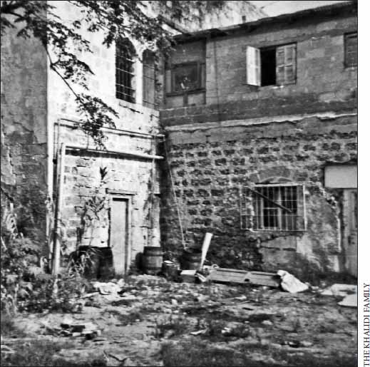 a black and white picture of a home that has collapsed