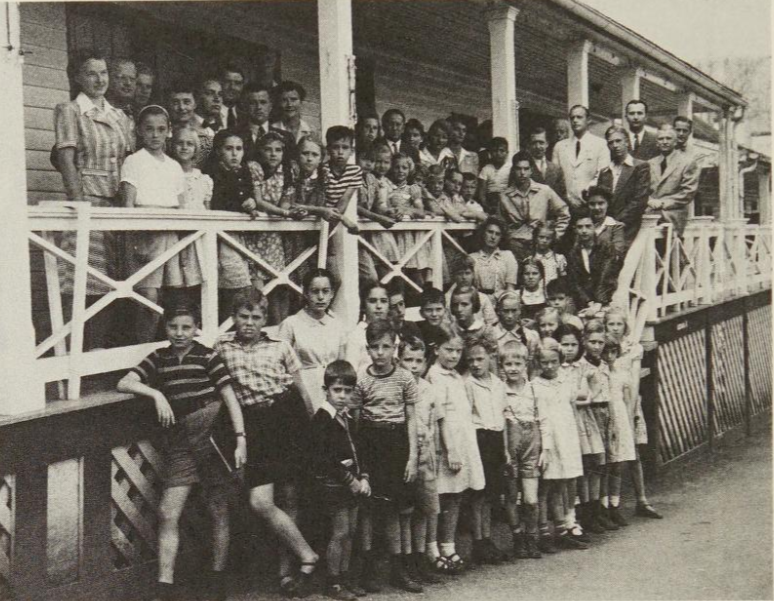 German women and children outside a schoolhouse at The Greenbrier. Gienanth is left of Hans Thomsen (standing, top row, light suit).