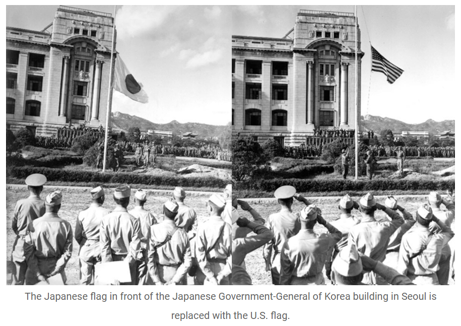 A side-by-side of two black and white photos. The first is of the Japanese flag in front of the Japanese Government General of Korea building being lowered, with US military watching. In the second picture, the US flag is raised on the same flag pole, with the US military personnel saluting it.