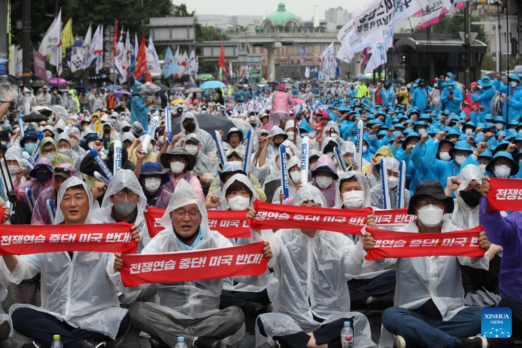 People rally to protest against the planned South Korea-U.S. military drills in Seoul, South Korea, Aug. 13, 2022.jpg