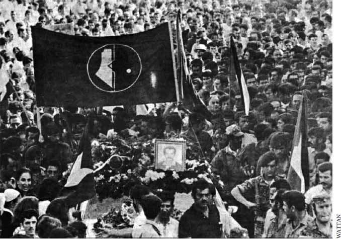 Black and white picture of a crowd of people at Ghassan Kanafani's funeral